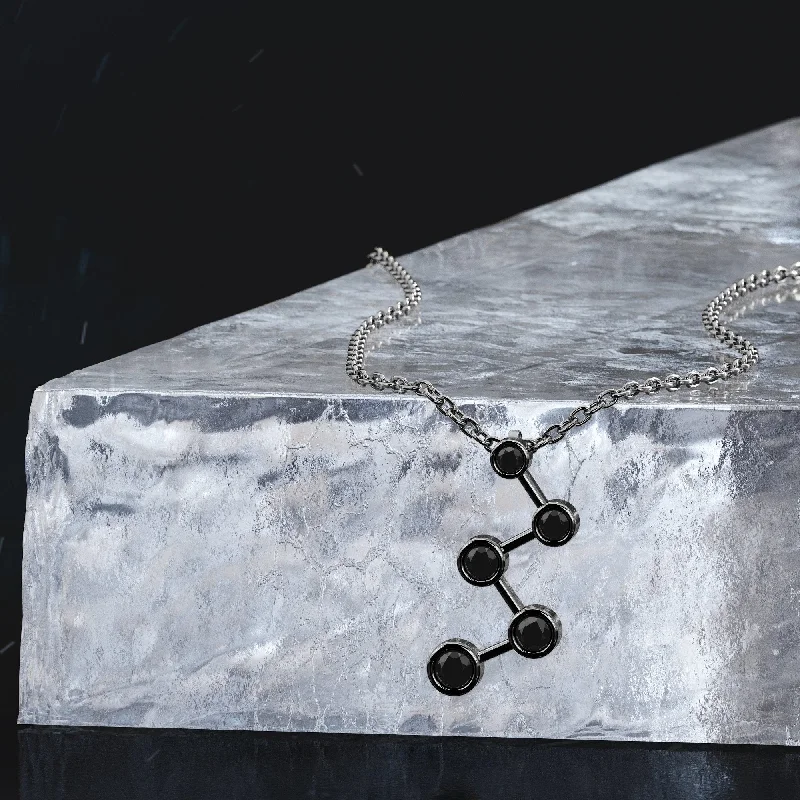 Solitaire Diamond Rings in Platinum SettingsNightfall Natural Black Diamond Alternative Pendant with a White Necklace