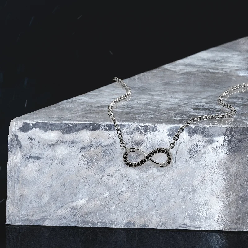 Three - Stone Diamond Rings with Princess - Cut DiamondsSadr Region Natural Black Diamond Alternative Pendant with a White Necklace